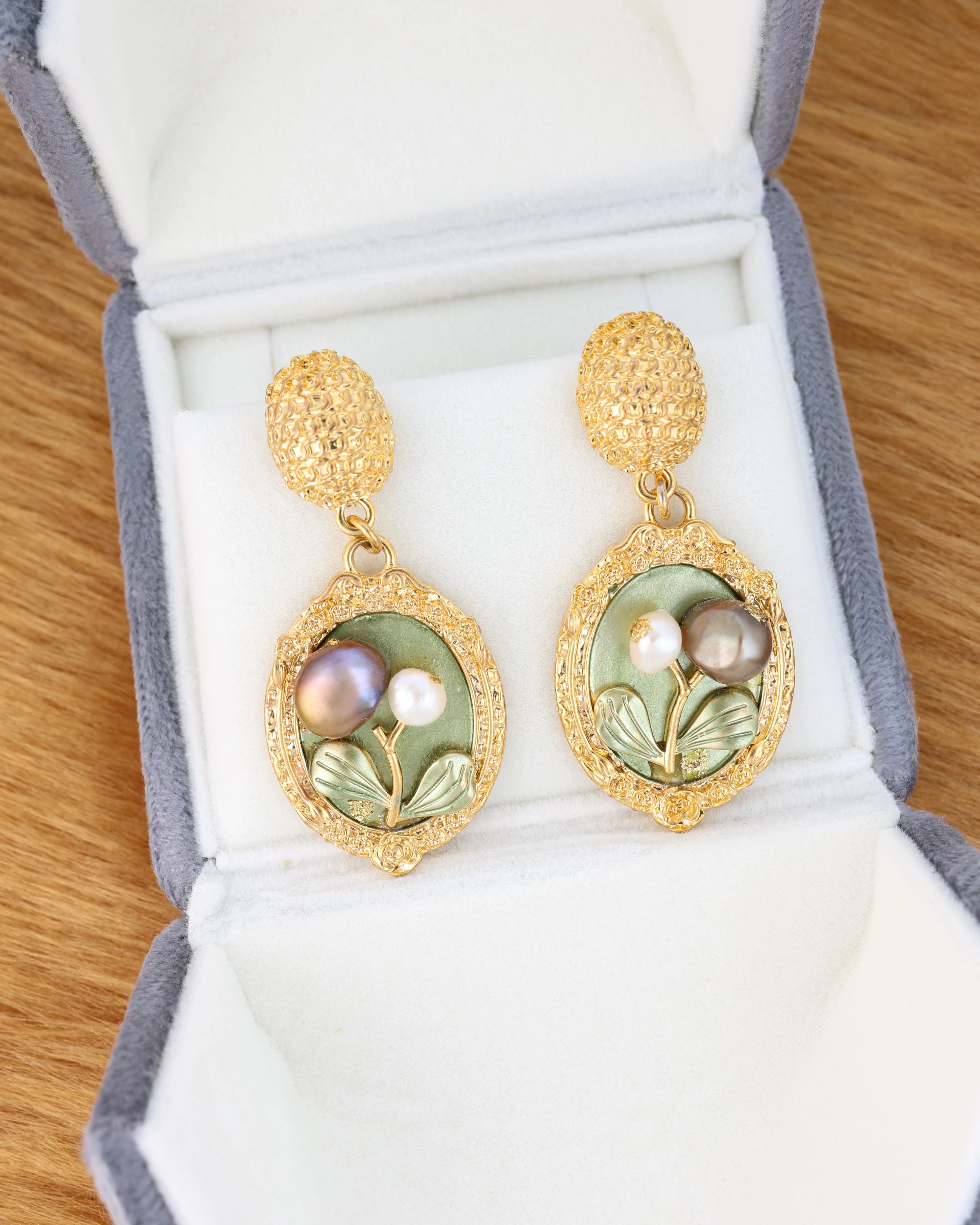 Pearl 18K Gold platted earrings with floral and pearl design in a jewelry box