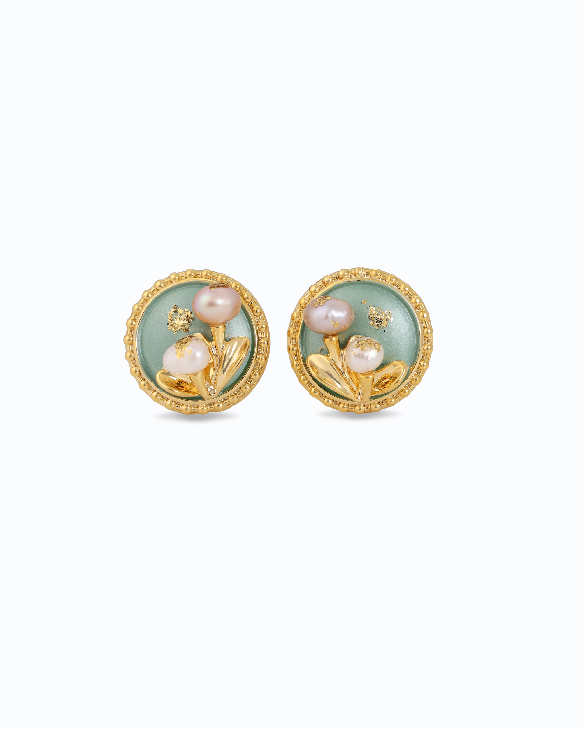 Pair of pearl earrings with gold and green design on a white background